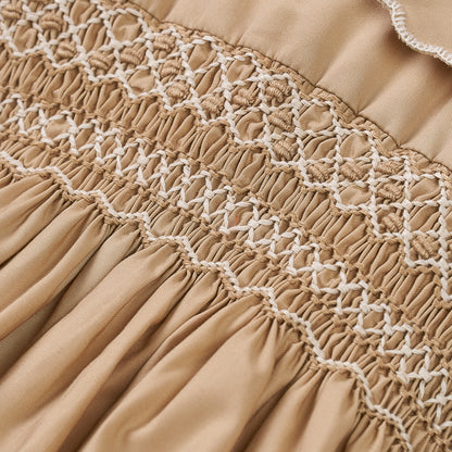 Hand Smocked Talia romper coffee cream