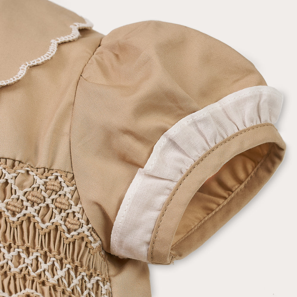 Hand Smocked Talia romper coffee cream