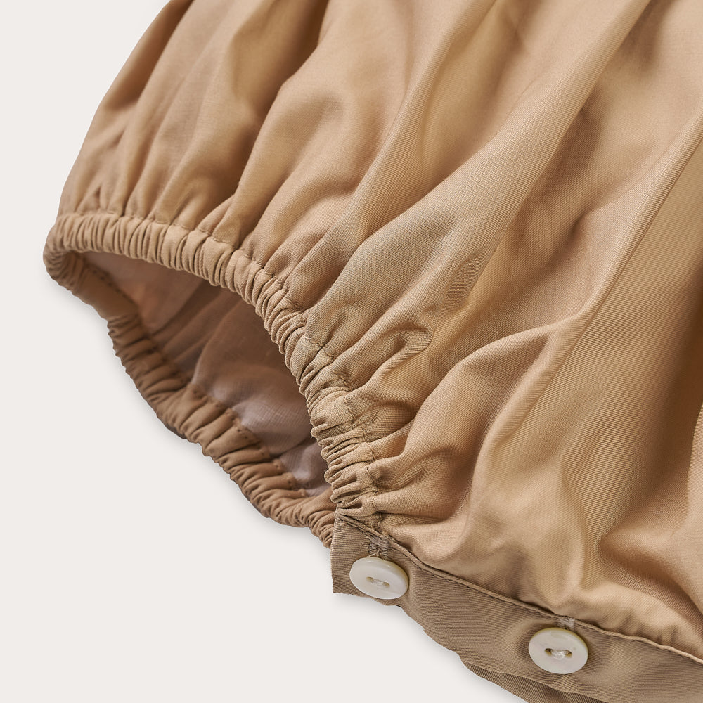 Hand Smocked Talia romper coffee cream