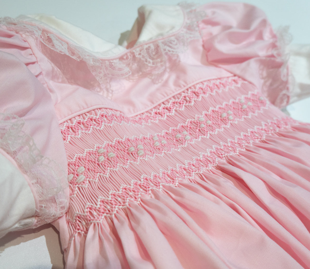 Hand Smocked Ellis romper soft pink